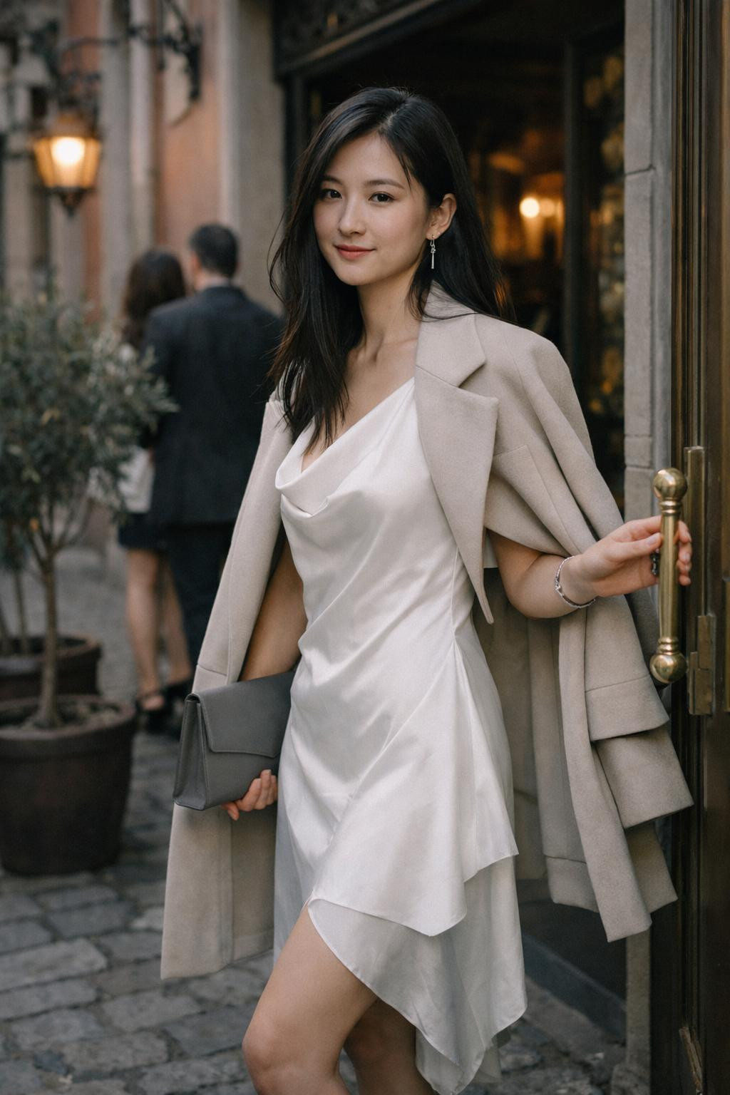 Dinner date outfit featuring white slip dress and structured coat
