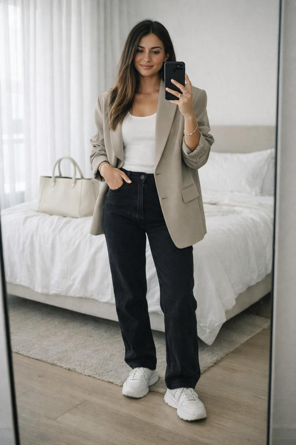 Black jeans outfit with beige oversized blazer and white tank