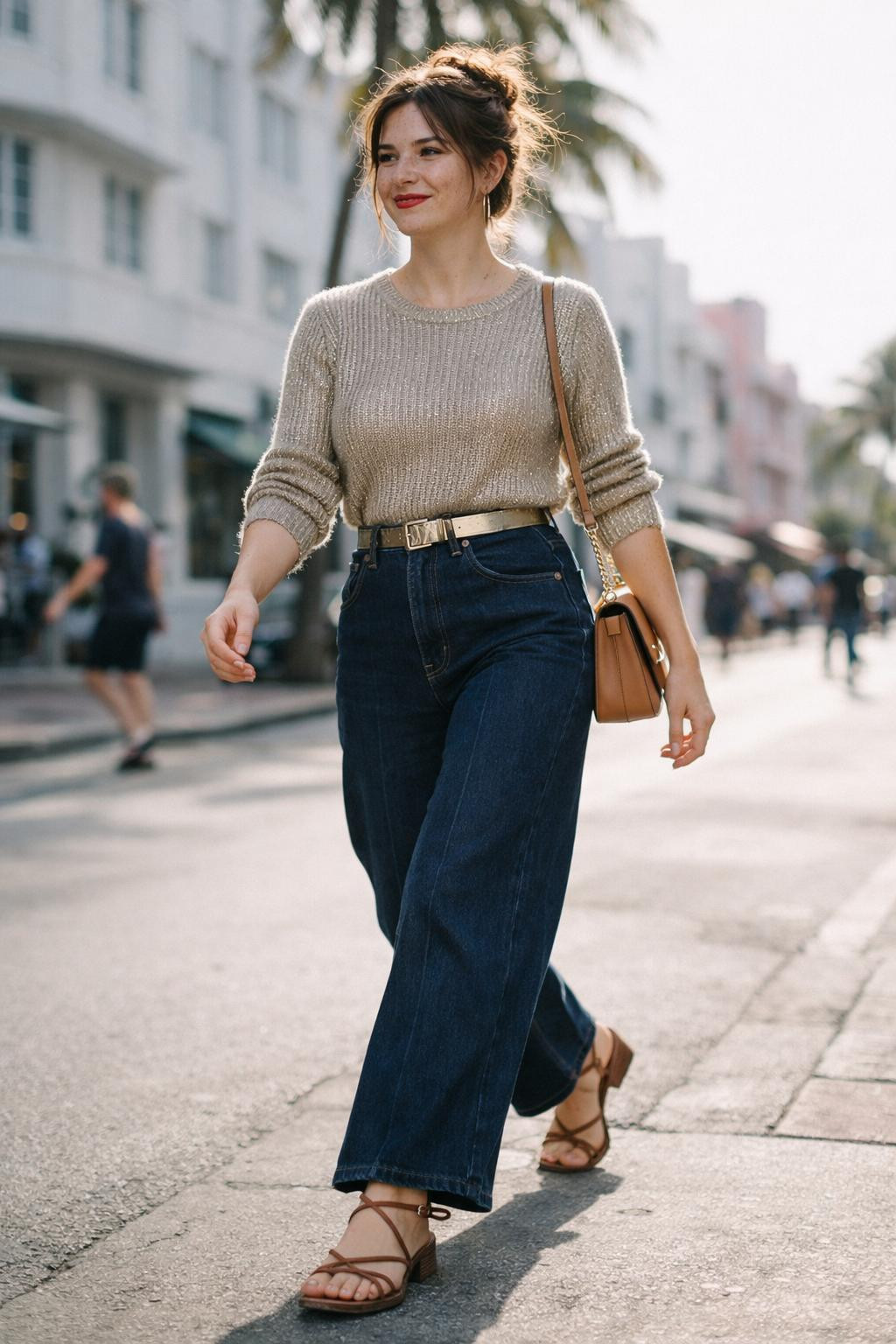 Wide leg jeans outfit with champagne metallic sweater and cognac belt