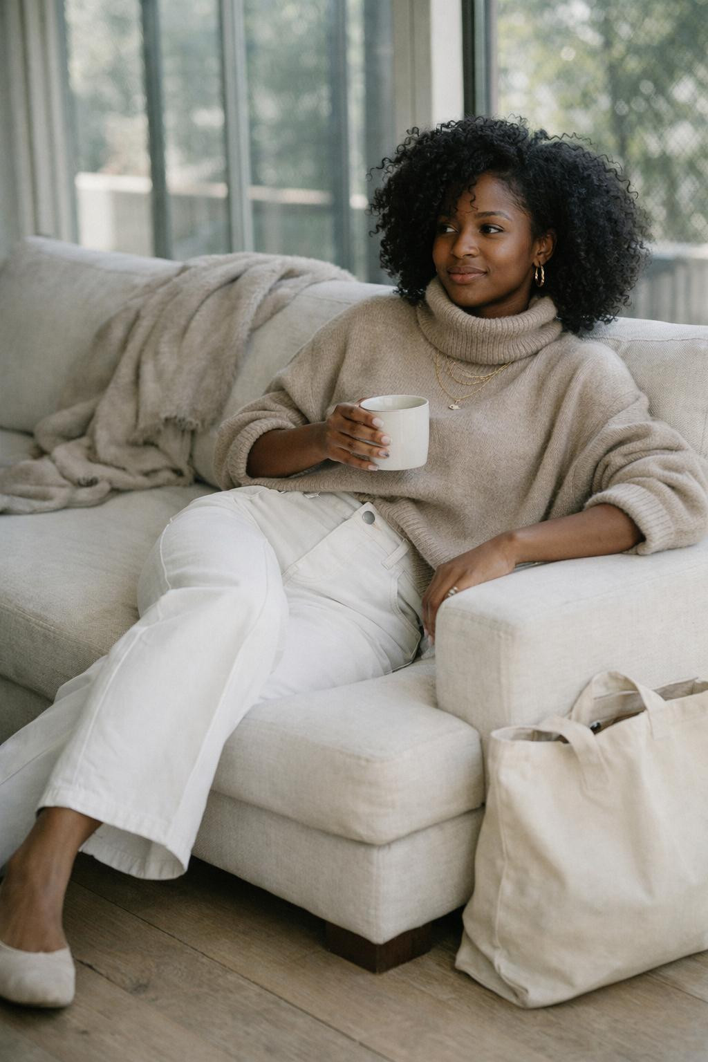 White jeans outfit with oversized beige cashmere turtleneck and wide-leg jeans