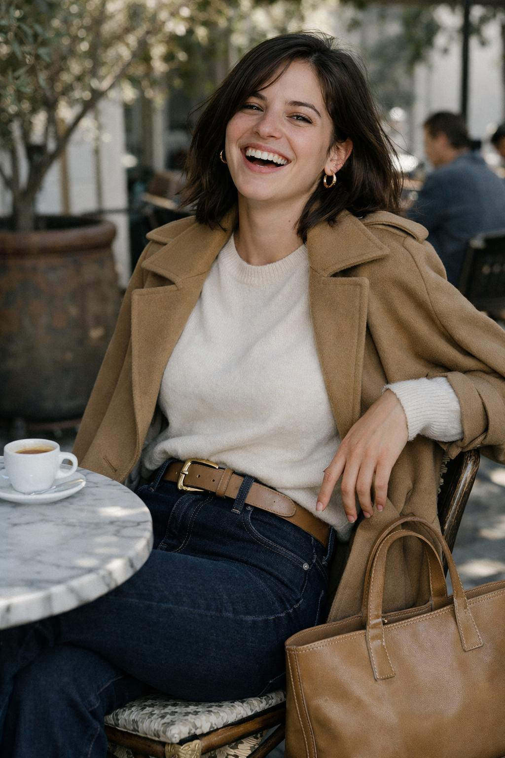 Bootcut jeans outfit with ivory cashmere and camel trench for café style