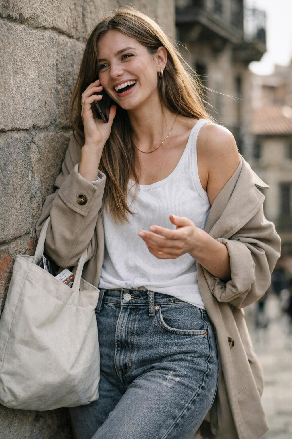 Grey jeans outfit with white tank and beige trench coat