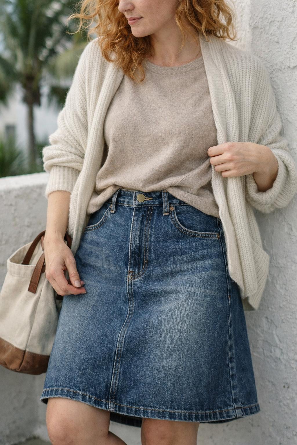 Jeans skirt outfit with vintage-inspired midi denim and beige sweater