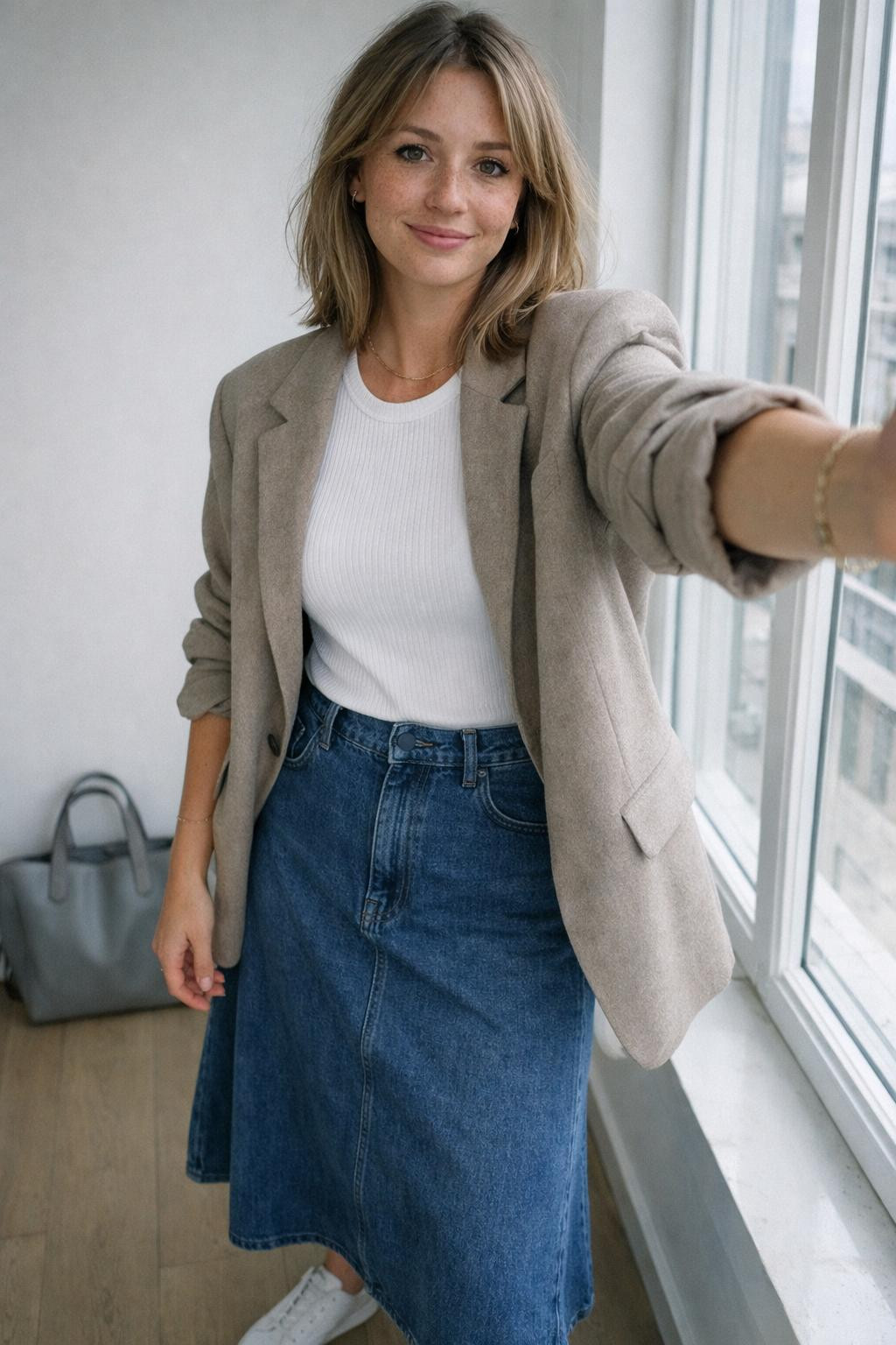 Jeans skirt outfit with midi denim and oversized beige blazer
