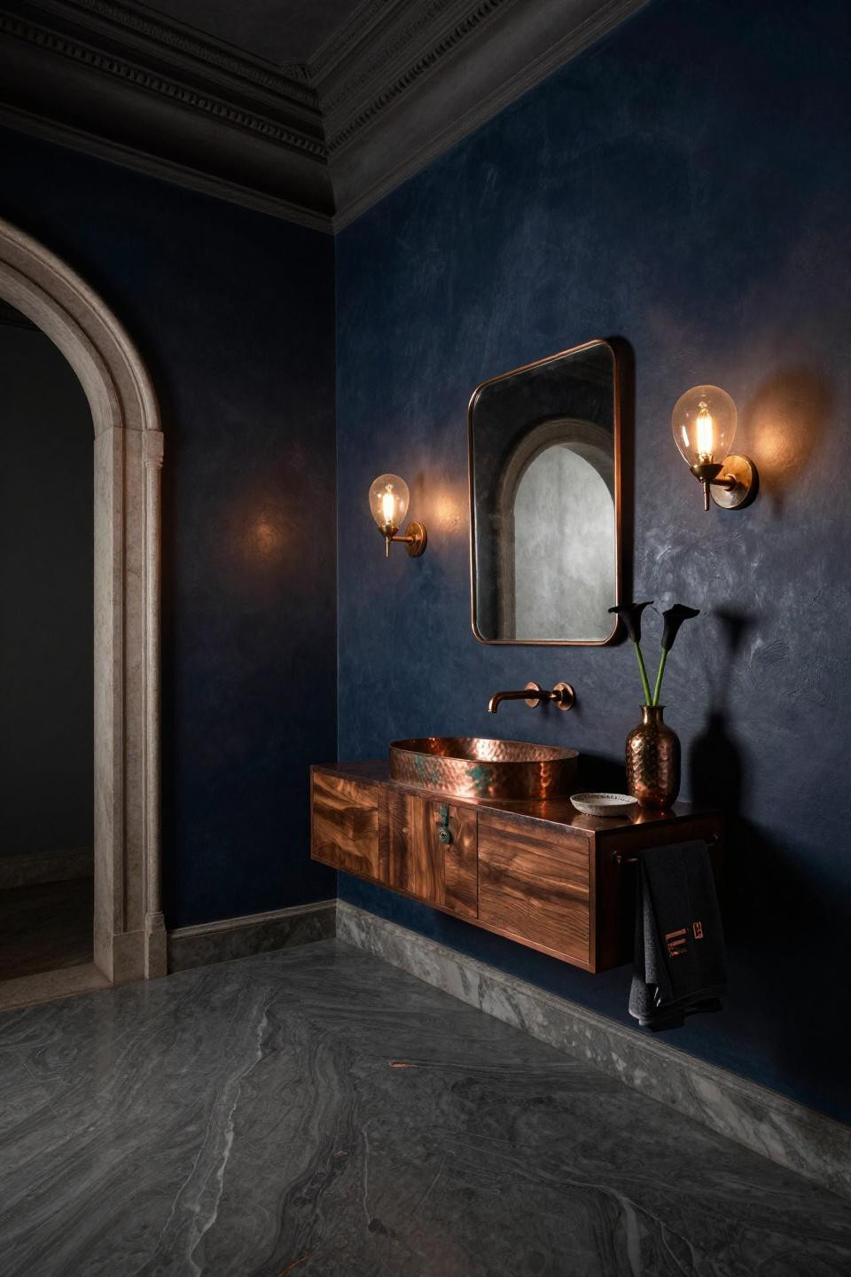 Dark half bathroom with aged copper vanity and smoky grey quartzite flooring
