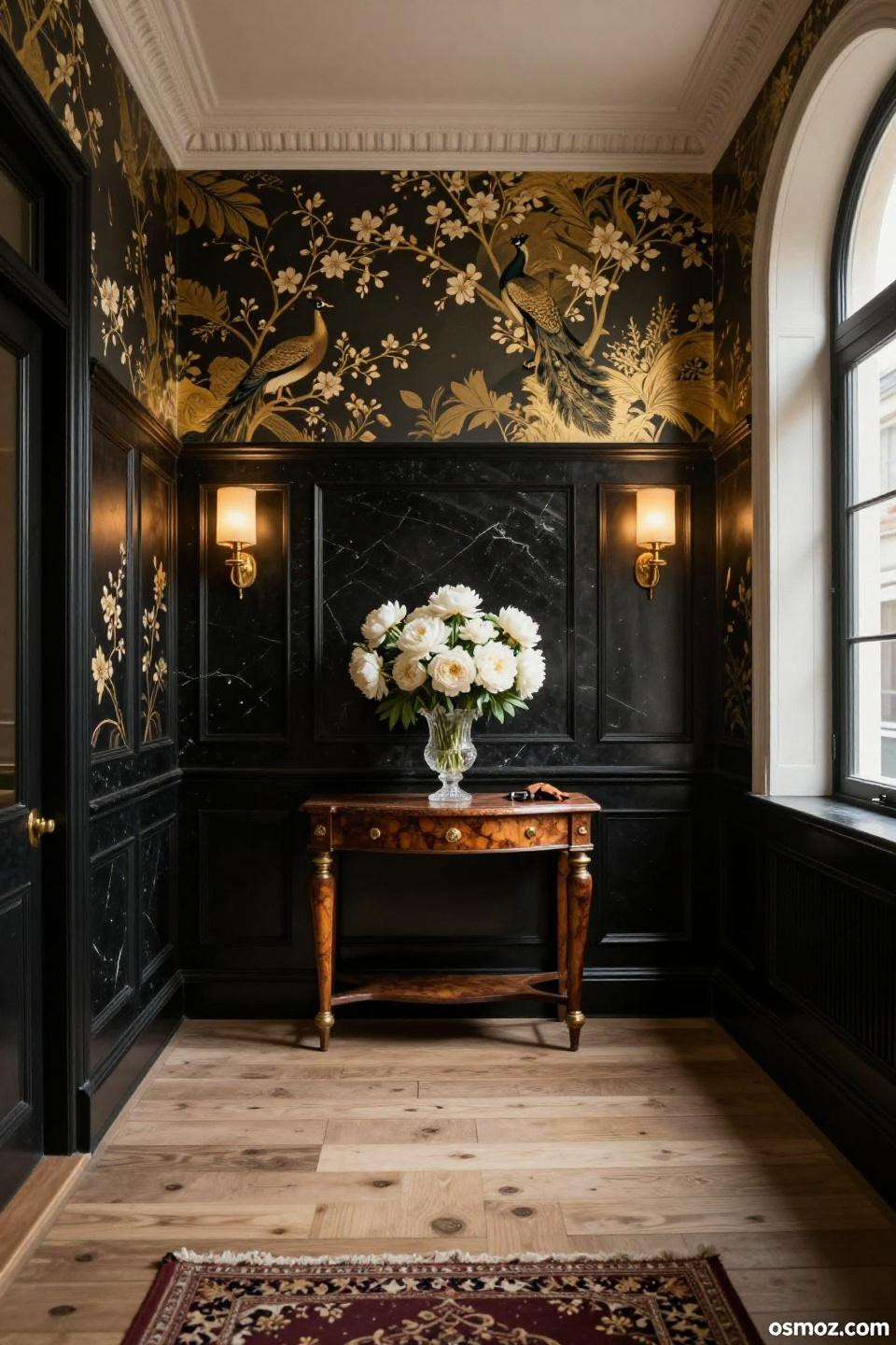 Floor-to-ceiling black onyx wainscoting topped with gold chinoiserie wallpaper
