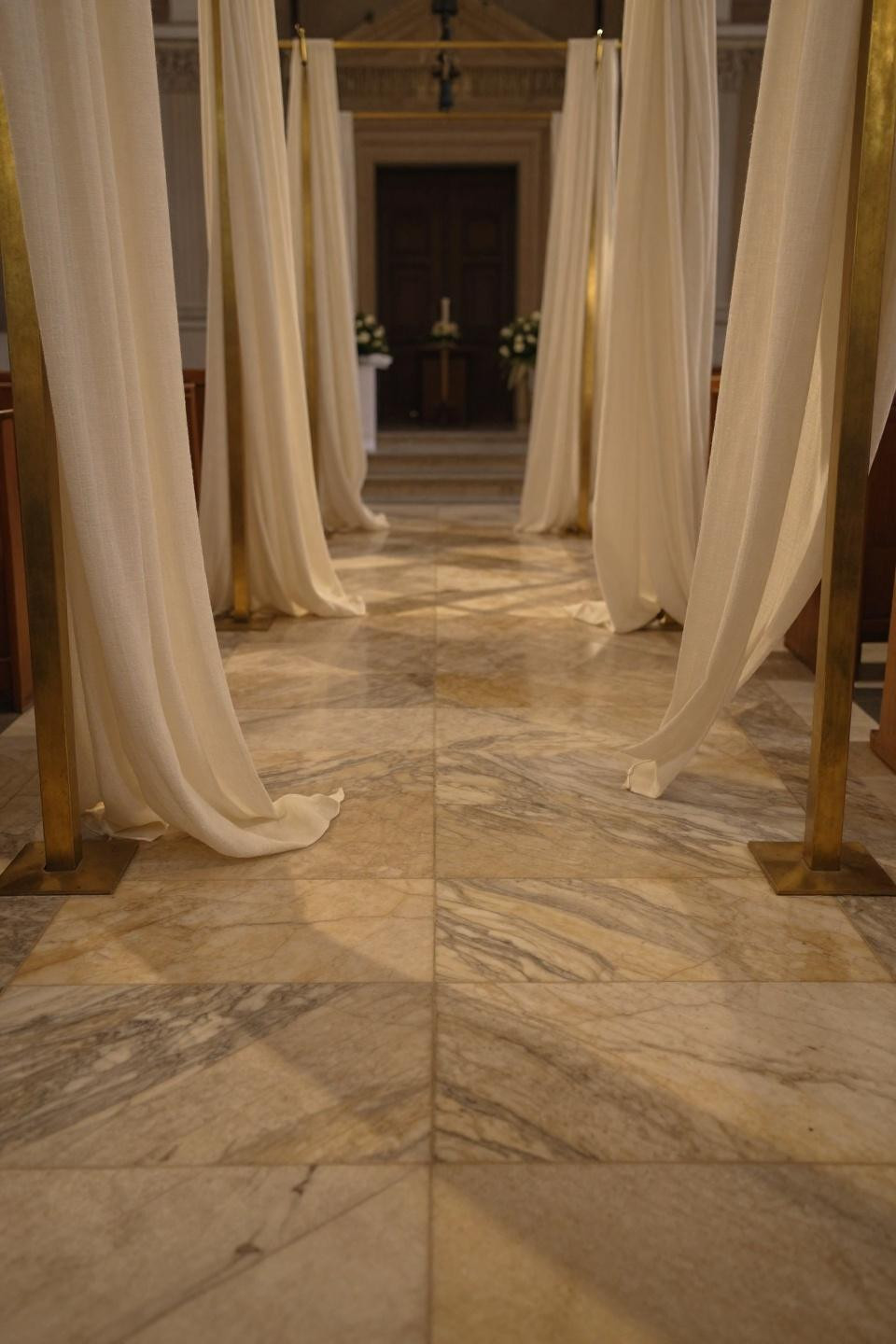 Wedding entrance decor walkways with cream linen and book-matched marble pavers