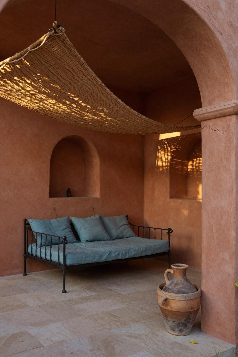 Covered patio ideas with Mediterranean clay barrel-vault ceiling and terracotta walls