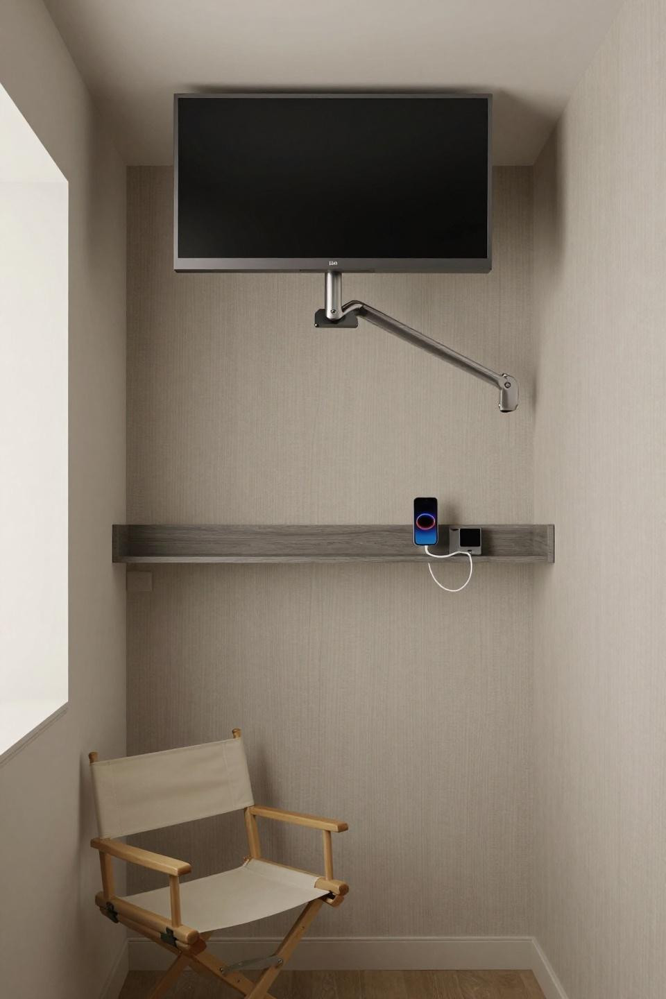Home theatre room ideas with 32-inch display on articulating arm in closet pod
