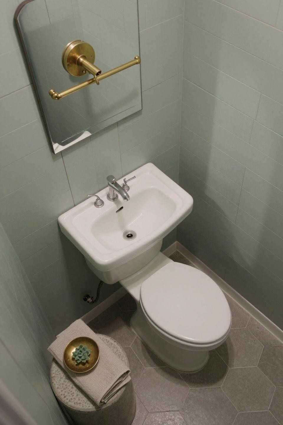 Tiny toilet room ideas with sage shiplap accent wall and geometric shadows