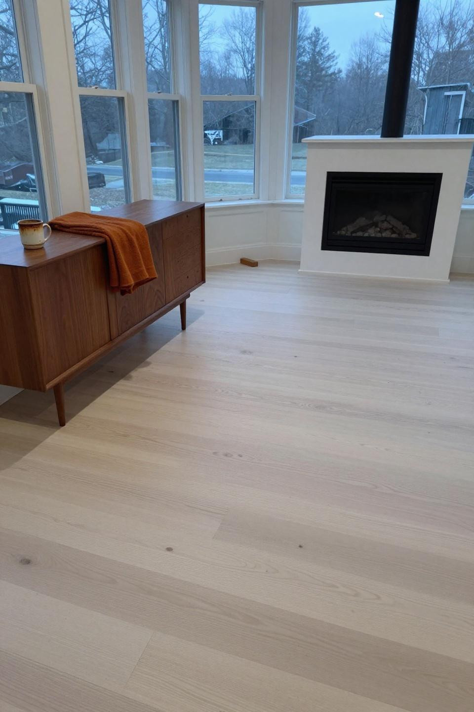 Blonde wood floors in contemporary great room with 45-degree angle planks