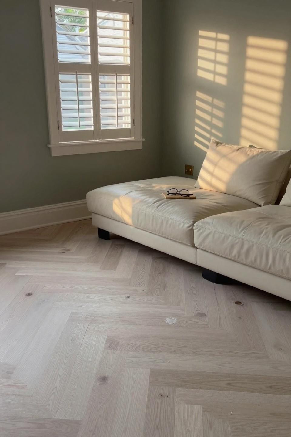 Natural white oak floors in transitional family room with chevron pattern