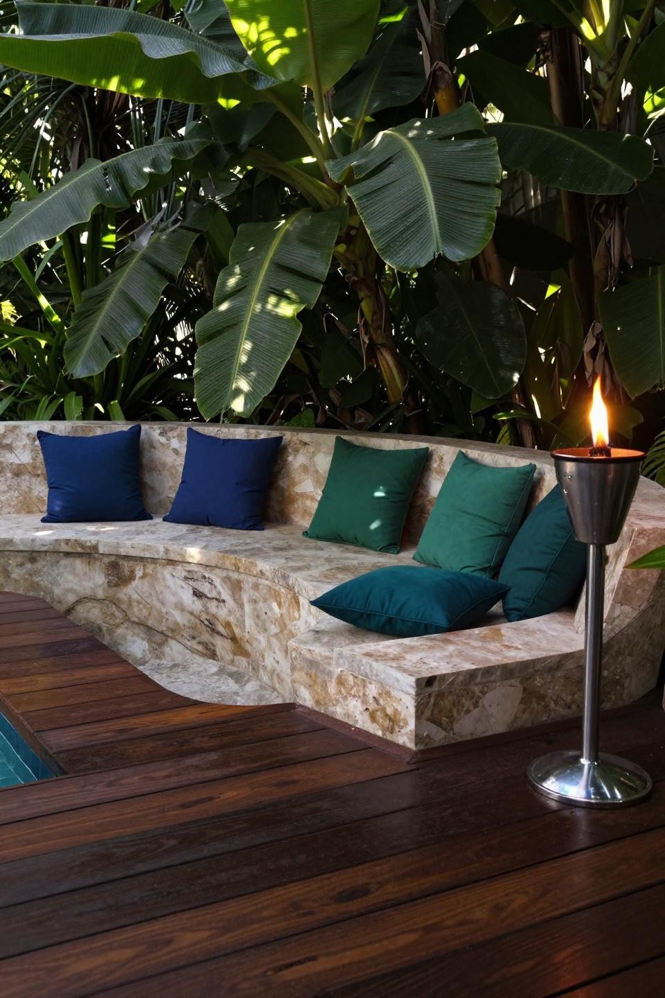 Simple backyard ideas with curved tropical hardwood decking and jewel-tone cushions