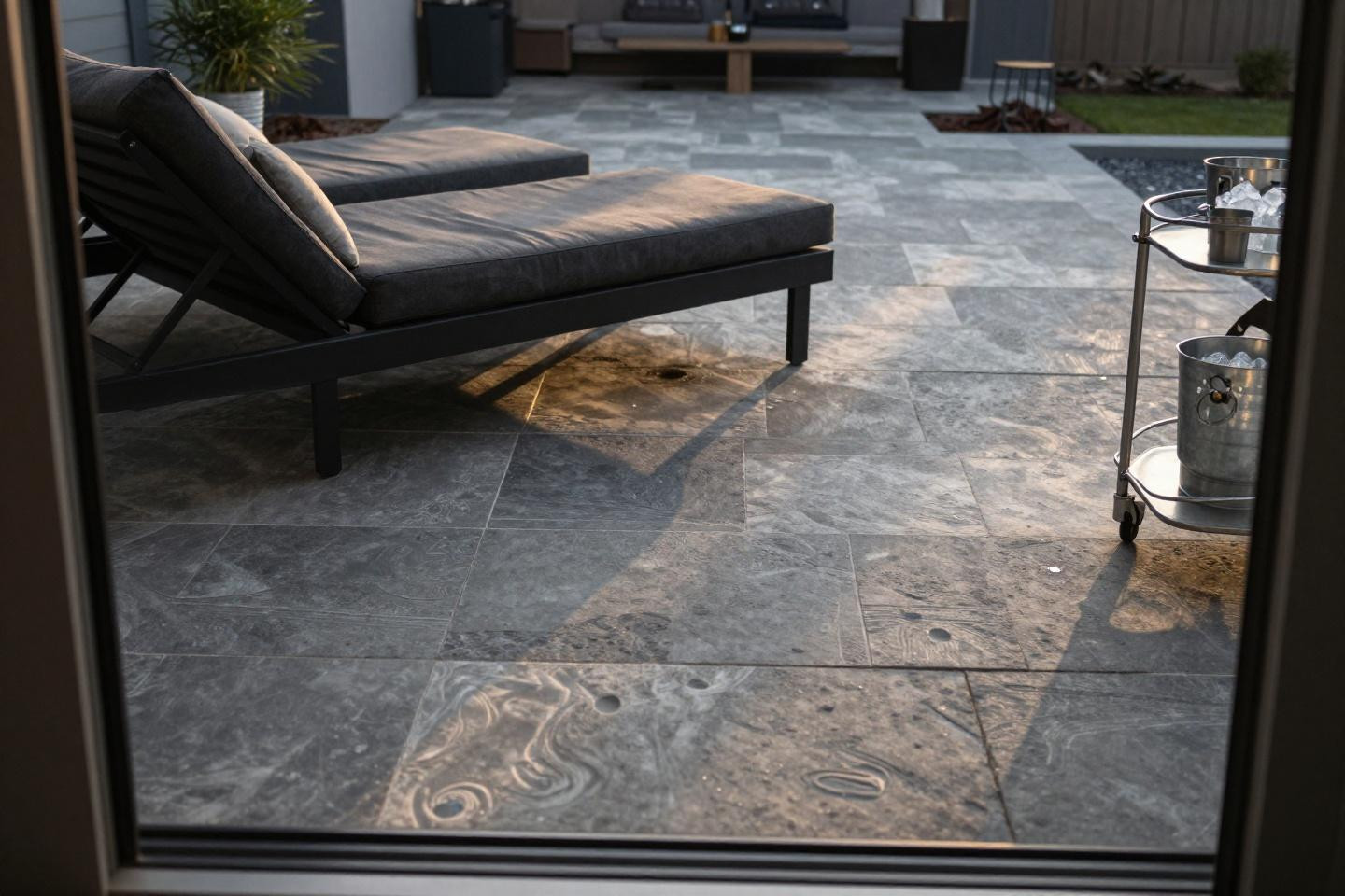 Modern stamped concrete patio with bold two-tone ashlar pattern