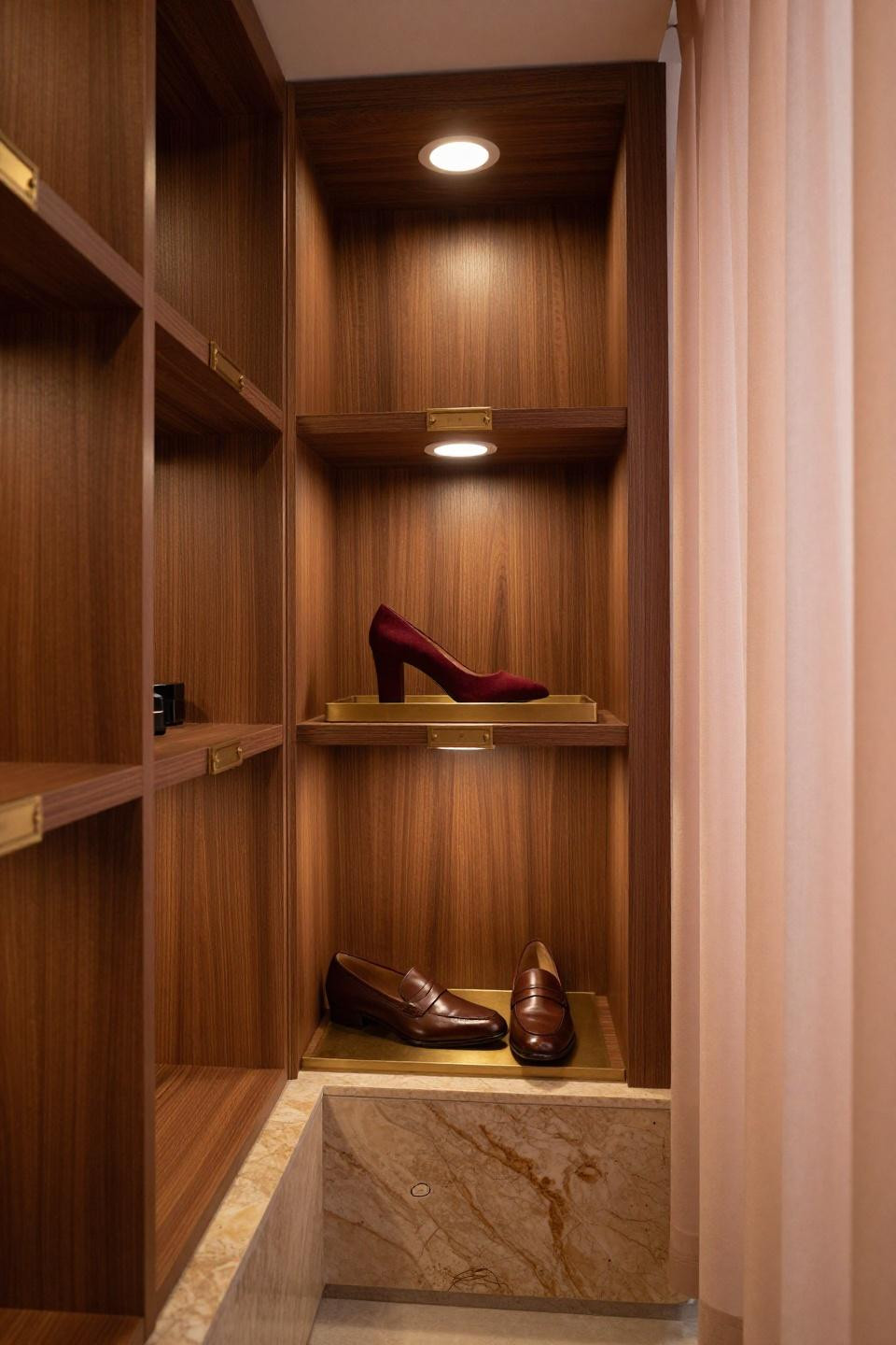 Shoe rack bench with luxury floating walnut cubicle wall system and brass label frames