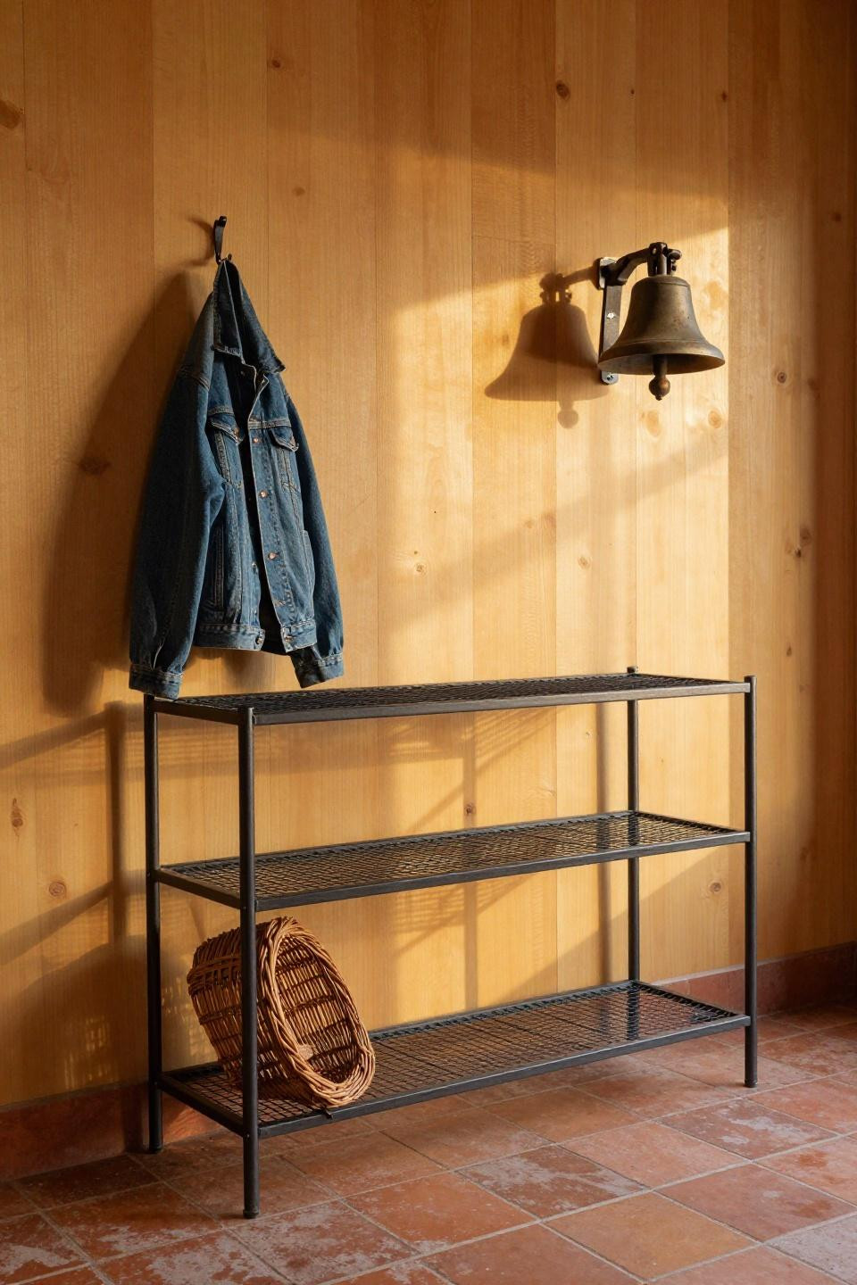 Farmhouse mudroom with charcoal steel mesh shelving against honey pine planks