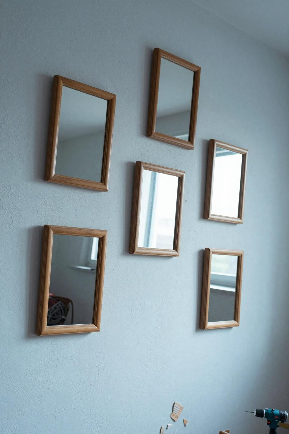 Home mirror decor with six beveled rectangular mirrors in honey wood frames