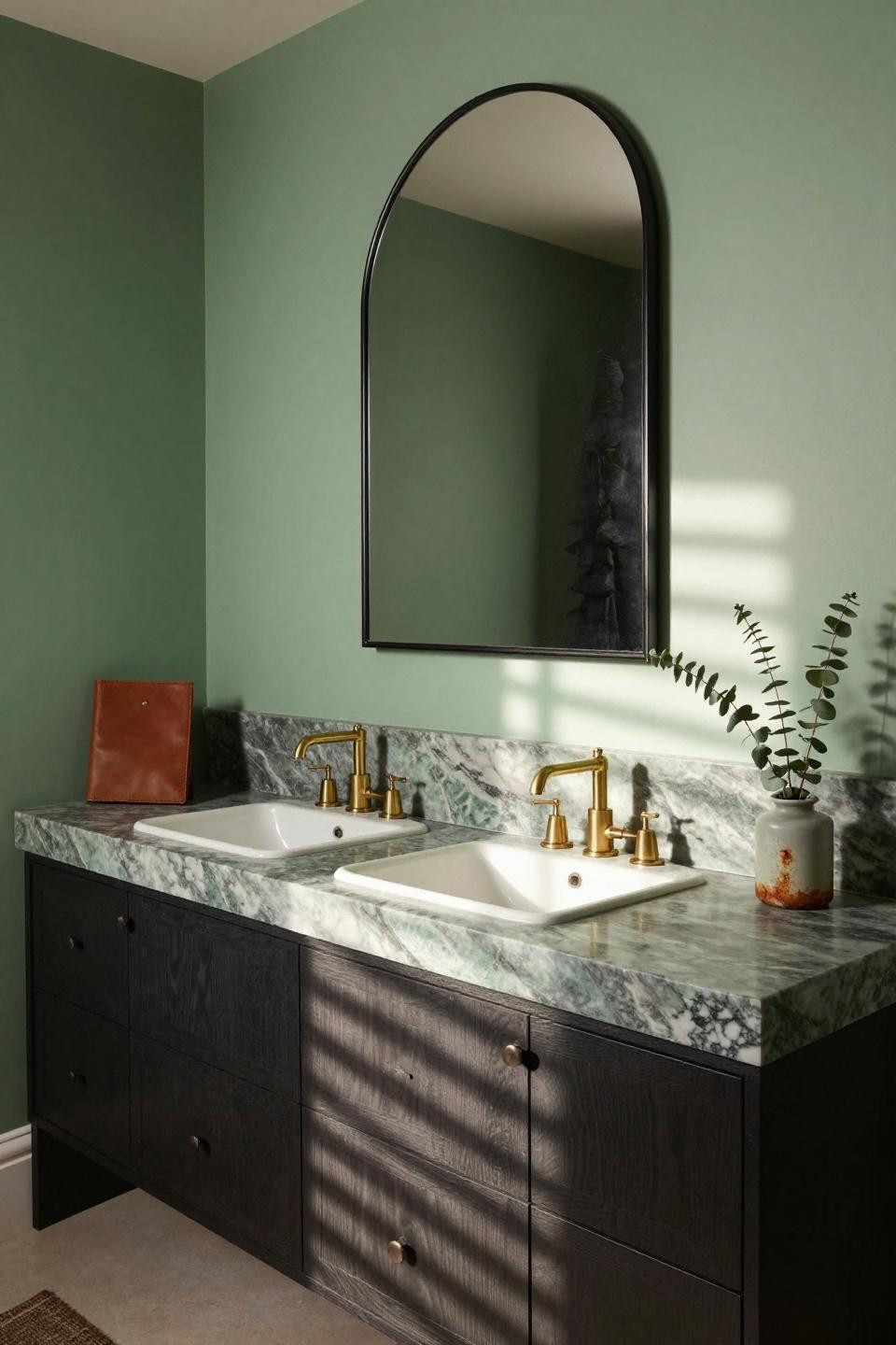 Dual sink bathroom vanity with charcoal cabinets and green marble countertop