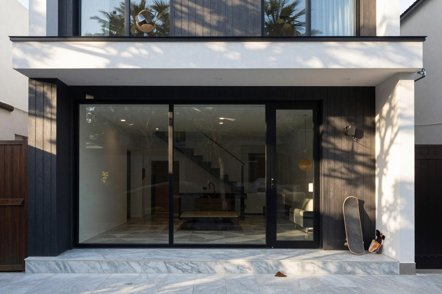 Bloxburg home layout featuring contemporary three-story mansion with dark charcoal vertical siding