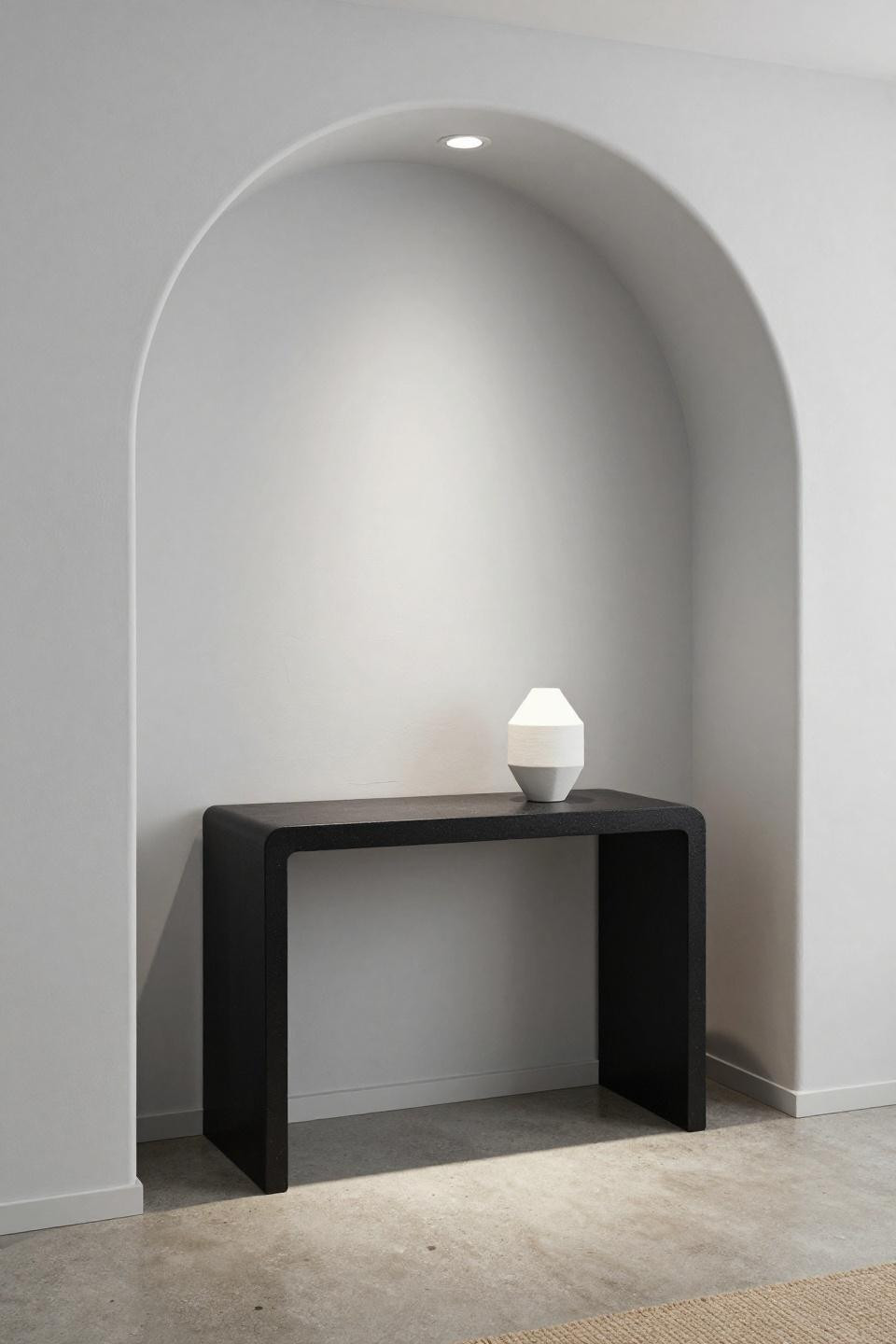 Bloxburg front door ideas with crisp white archway framing blackened steel console