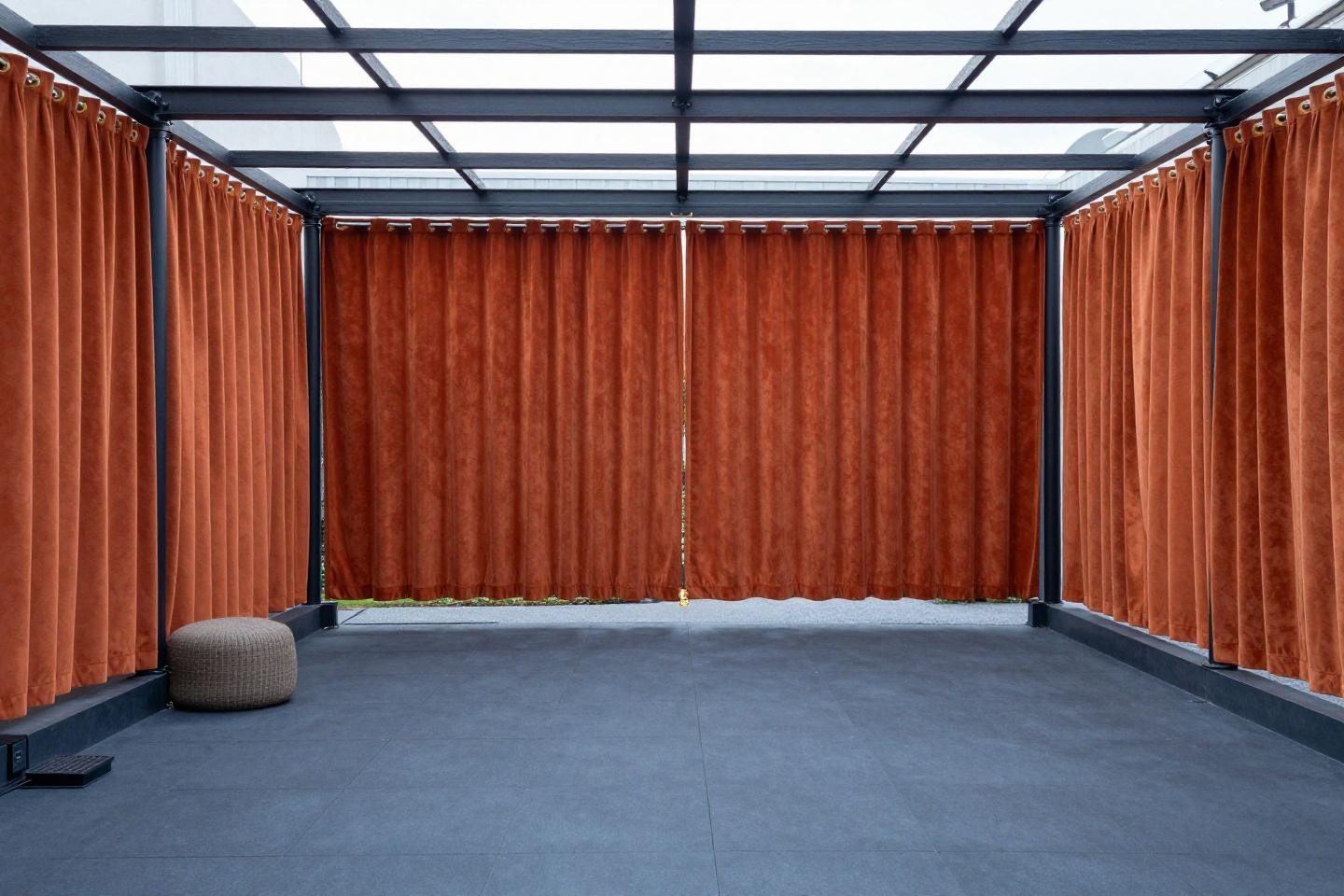outdoor flooring with rust-orange curtains on matte-black industrial pipe