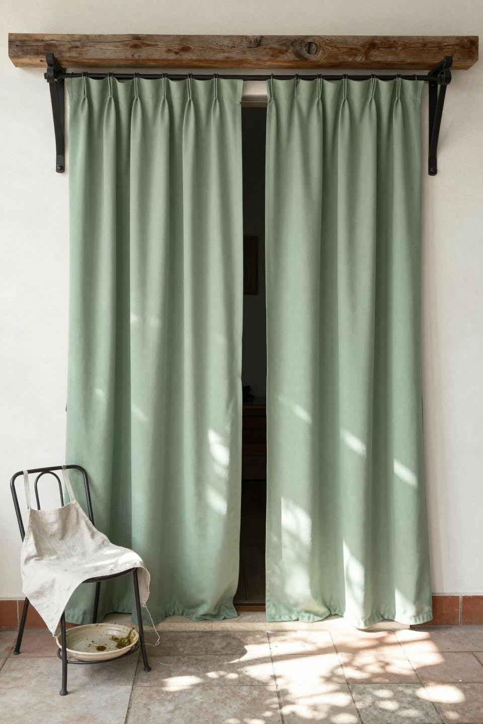 pergola patio with sage-green outdoor curtains on timber beam brackets