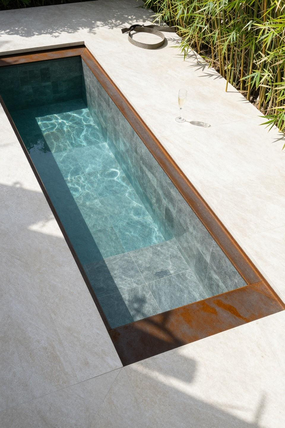 Pool area ideas with recessed rectangular cocktail pool and Corten steel coping