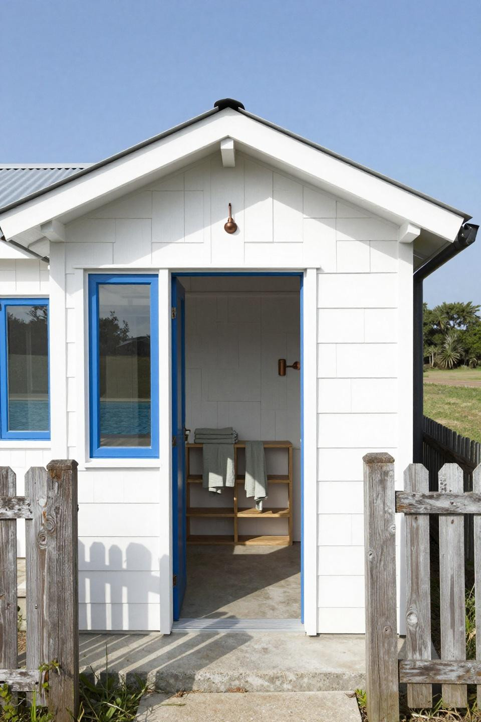 Outdoor pool house ideas with whitewashed shiplap and corrugated metal roof