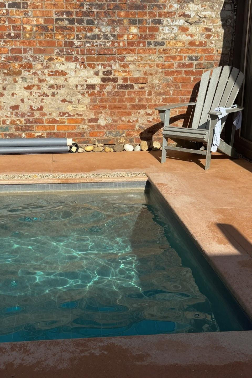 Plunge pool ideas small spaces with brick backdrop