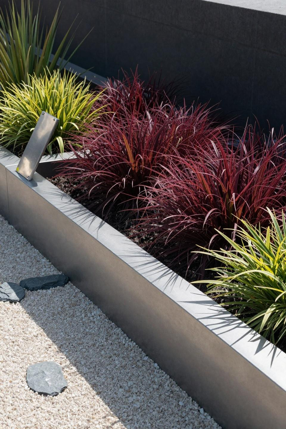 Flower beds around house featuring steel-edged raised bed