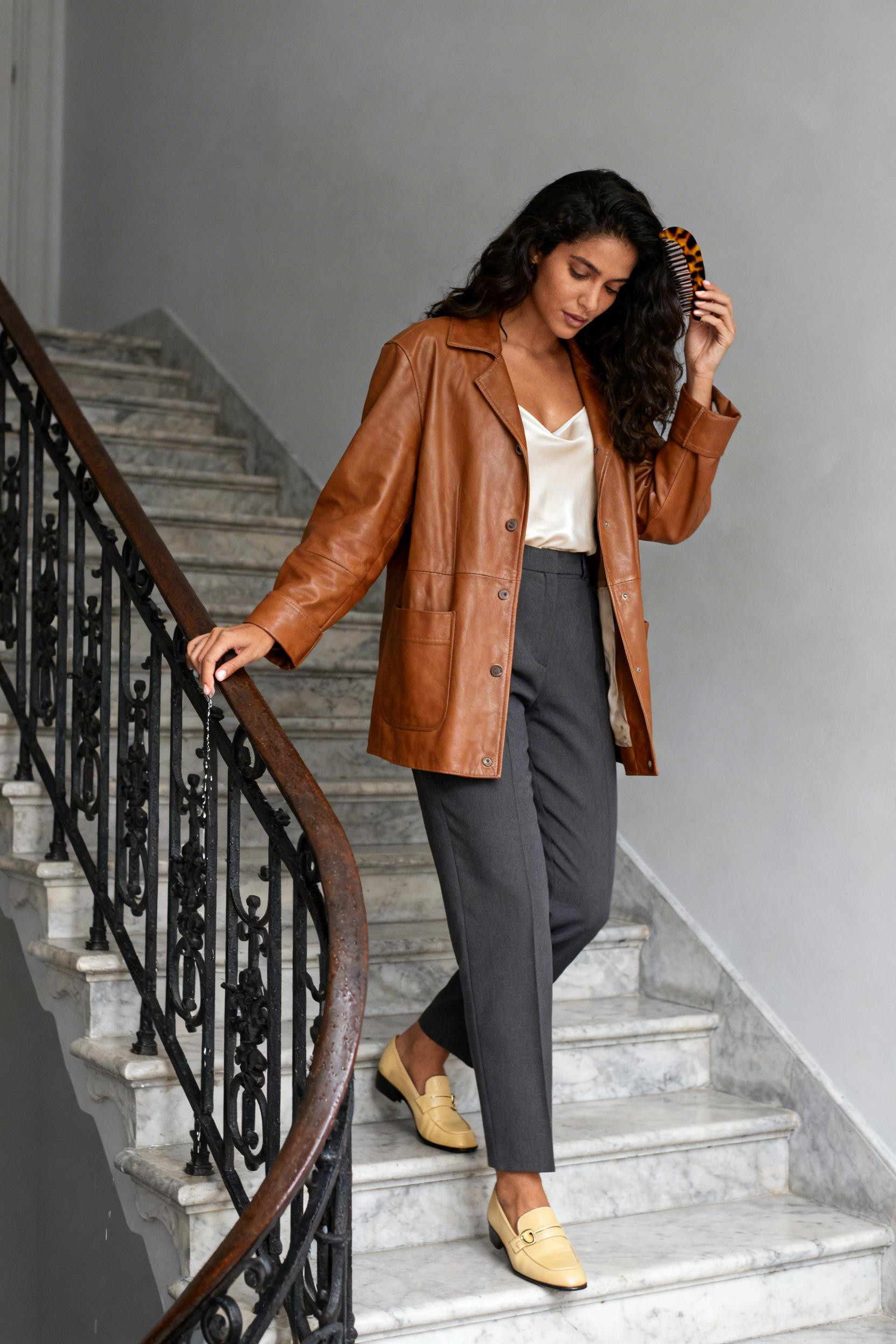 Old Money Fashion - cognac leather jacket charcoal trousers