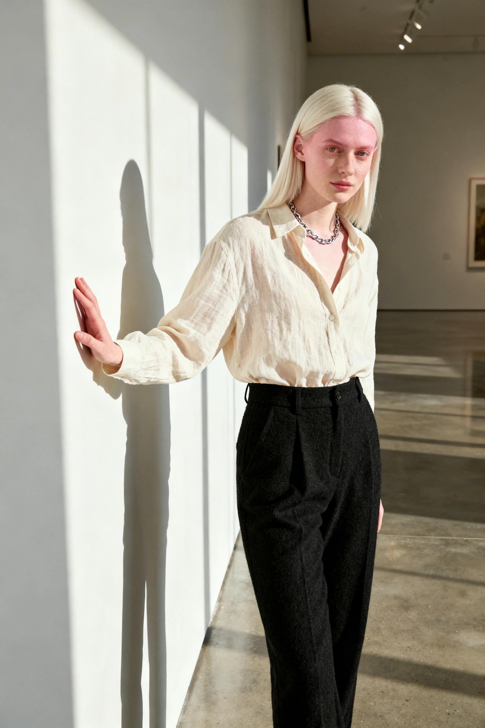 Kendall Jenner - cream shirt black trousers