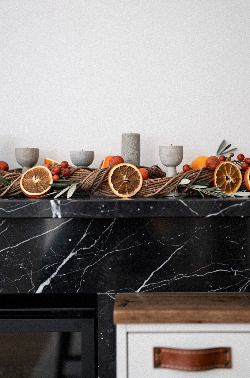 Black mantel? Try dried orange slices woven through cedar