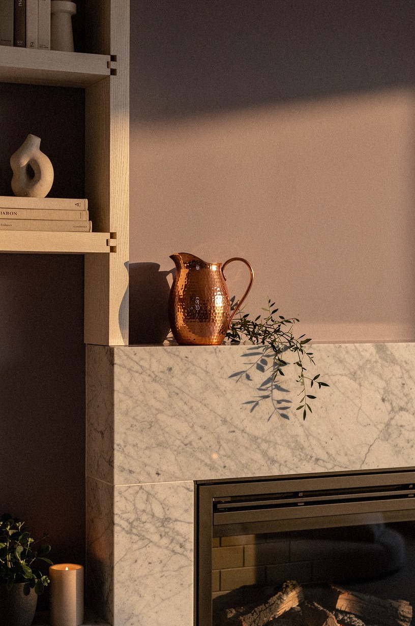 Place one copper pitcher near the edge