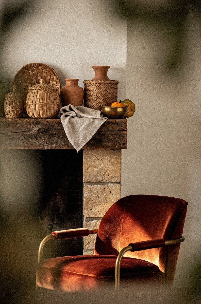 Frame the hearth with woven baskets rather than more shelf clutter