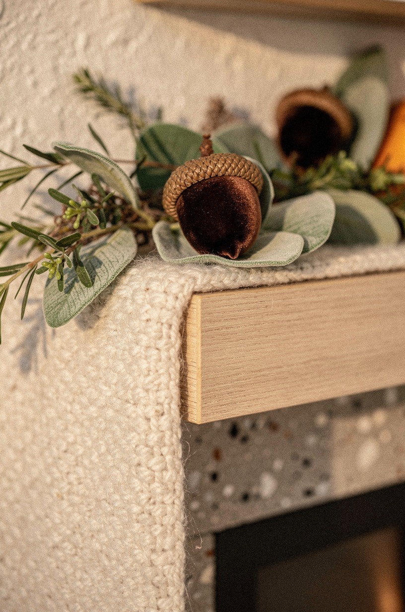Tuck velvet acorns into the greenery