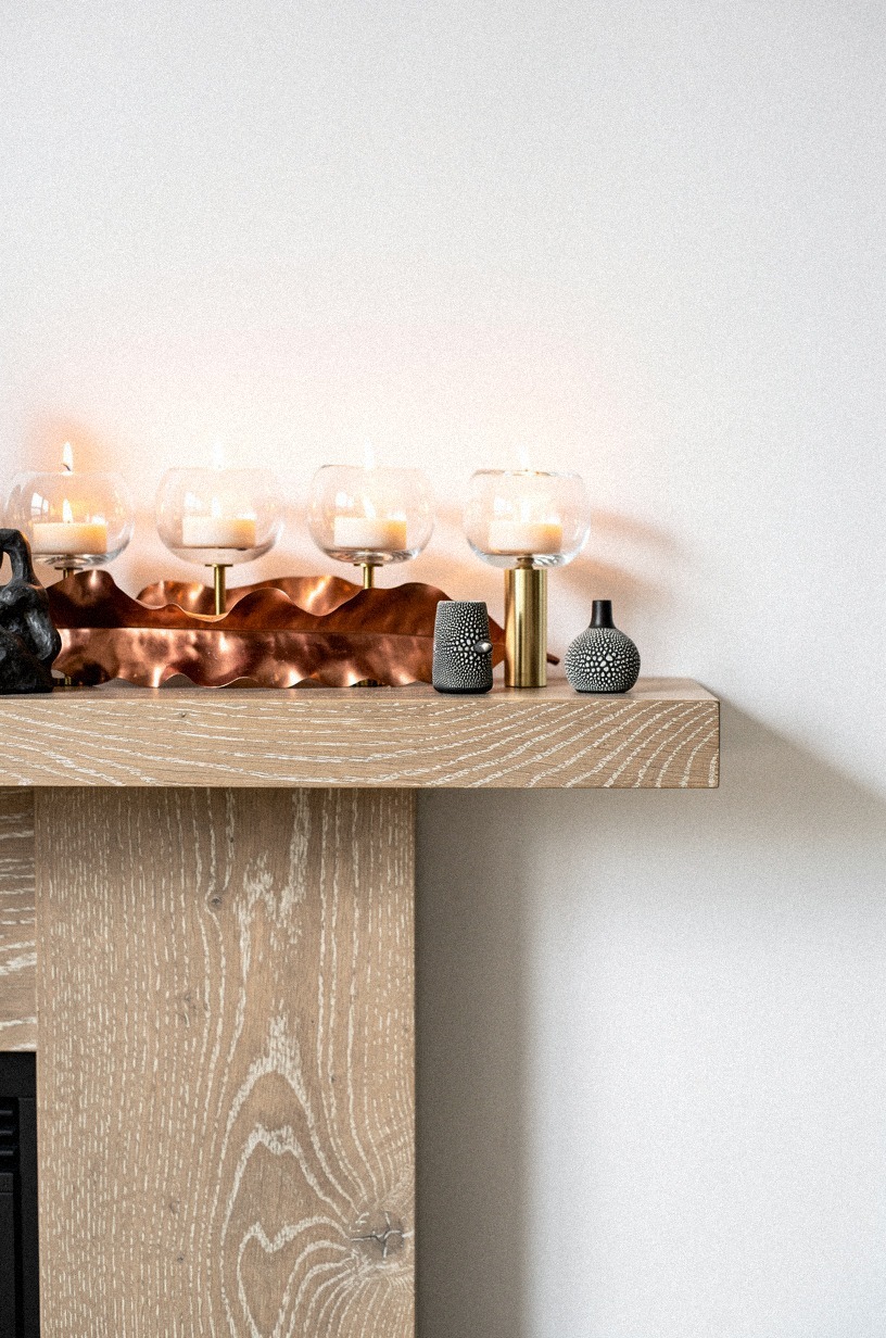 Float candles above a copper leaf runner