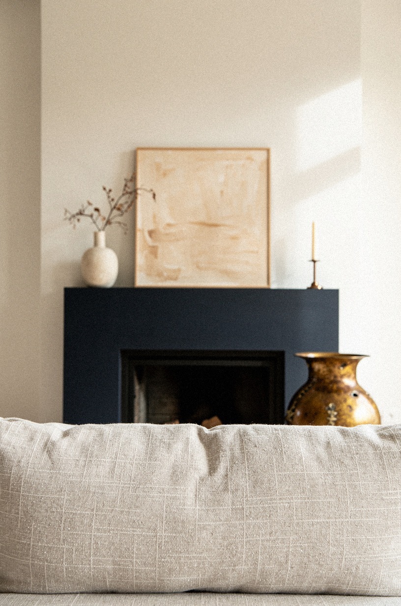 Leaned small beige artwork against the wall