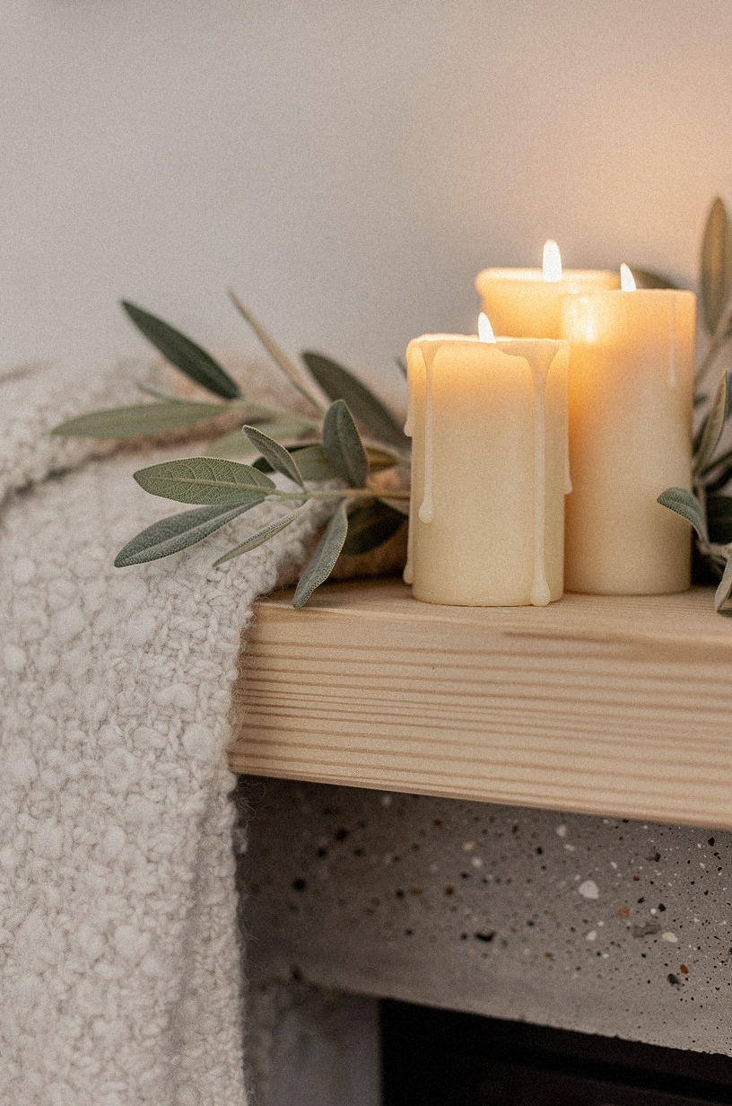 Grouped bone taper candles near one end