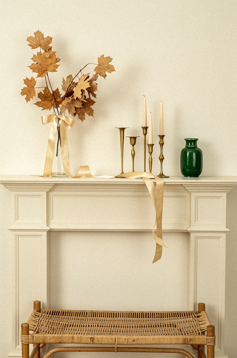 Drape champagne ribbon through dried maple stems