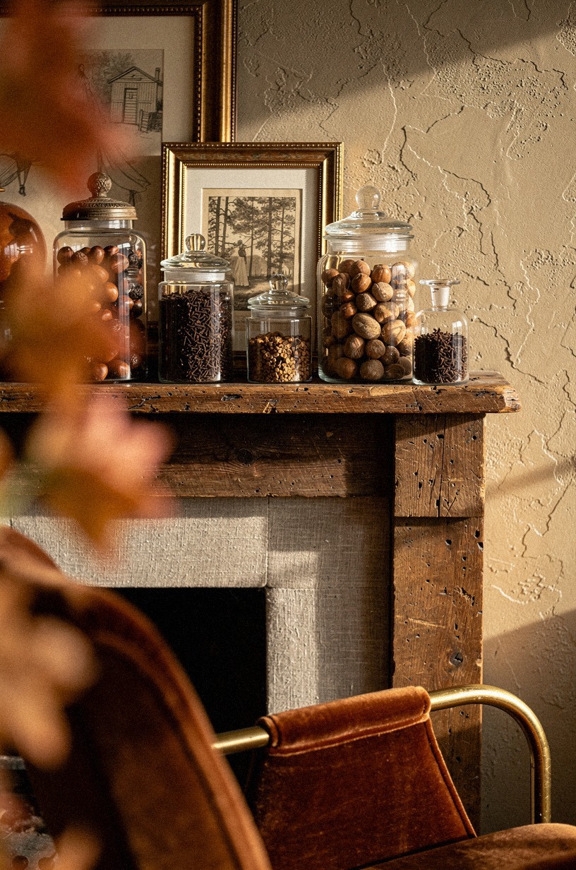 Fill apothecary jars with acorns and cloves