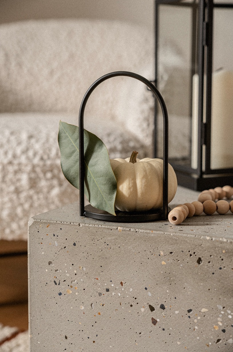 Frame the hearth with black metal lanterns