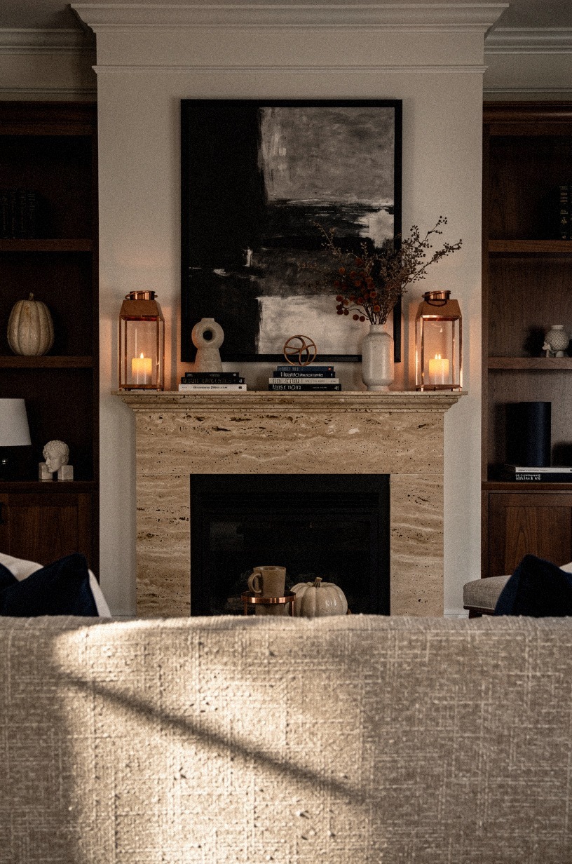 Layer charcoal art behind copper lanterns