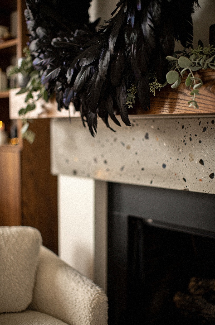 Crown the mantel with a raven feather wreath