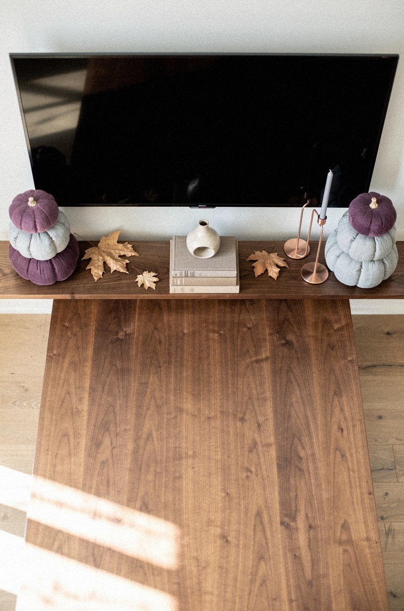 Anchor each mantel end with stacked pumpkins