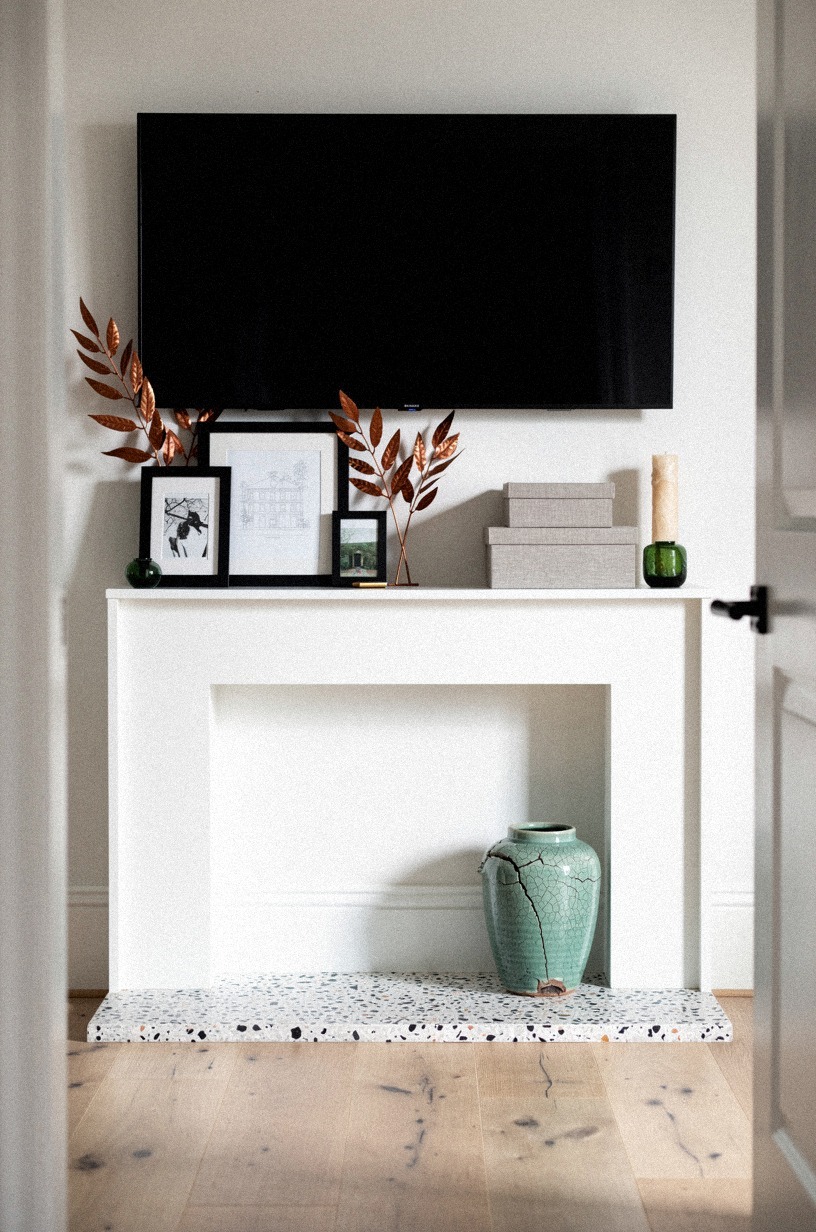 Tuck copper leaf stems behind black frames