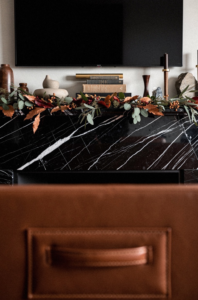 Float picture lights above the mantel garland