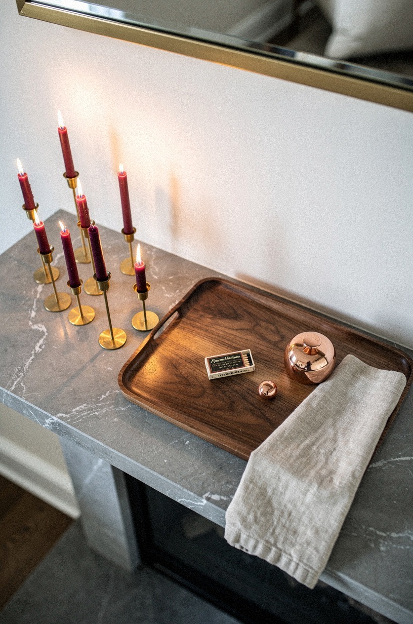 Set Brass Tapers Beside the Mirror
