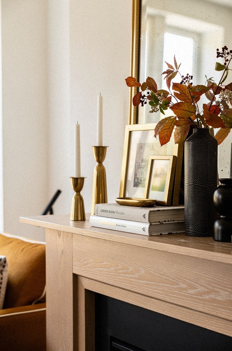 Prop a gilt mirror over stacked art (Gold, Then Paper, Then Air)