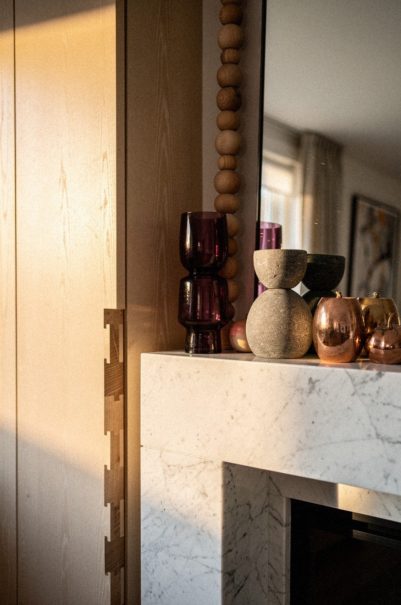 Balance tall mirrors with chunky wood beads (The Weight-on-the-Lower-Line Rule)
